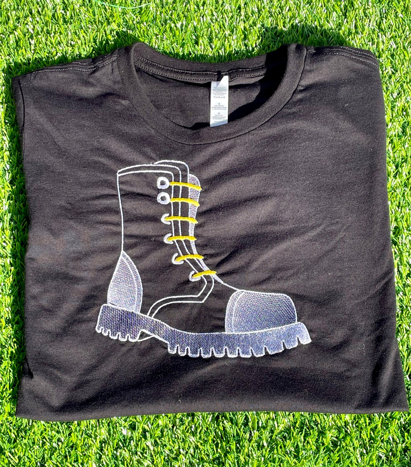 Boot design on Black Short Sleeved Unisex T-shirt